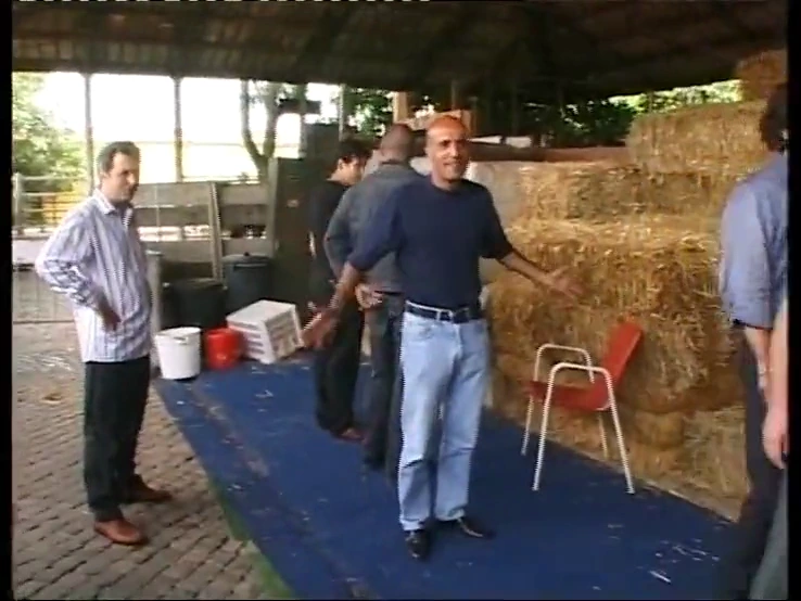 A group of men have sex with an innocent-looking blonde in a barn porn video